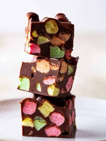 Stack of chocolate marshmallow bar with colorful fruity marshmallows.