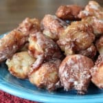 Gluten-Free Apple Fritters on a blue plate.