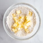 Butter cubes on gluten-free flour for a pie crust recipe