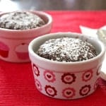 Two gluten-free chocolate cakes in small ramekins.