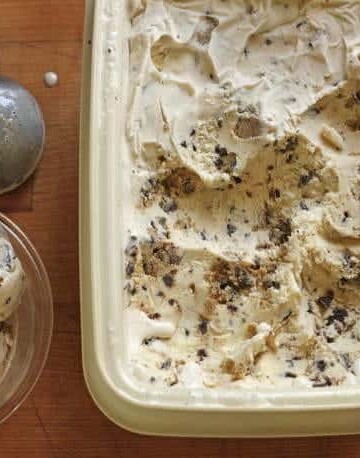 Gluten-free chocolate chip cookie dough ice cream in container.