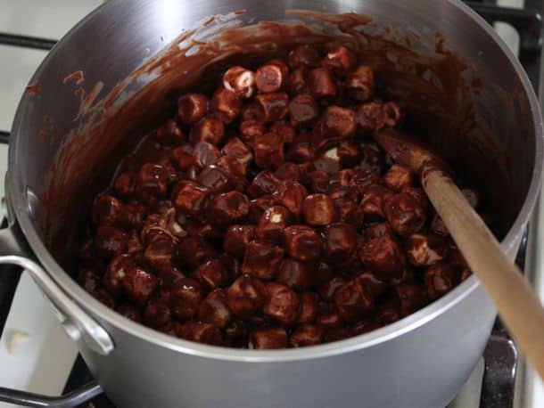 Marshmallows coated in melted chocolate mixture.