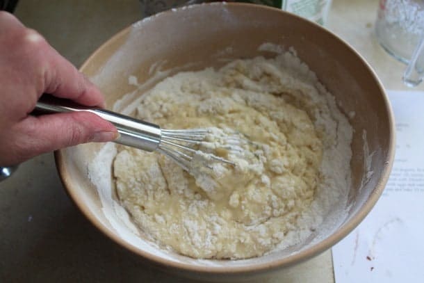 Mixing ingredients for gluten-free cola cake.