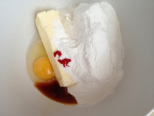 Ingredients for gluten-free Valentine's sugar cookies in a bowl.