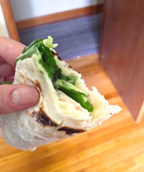 Gluten-Free flour tortilla filled with lettuce, cheese, and turkey.