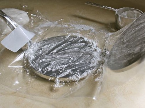 Gluten-Free Flour Tortilla press covered with plastic.