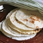 Gluten-free flour tortillas on a plate.