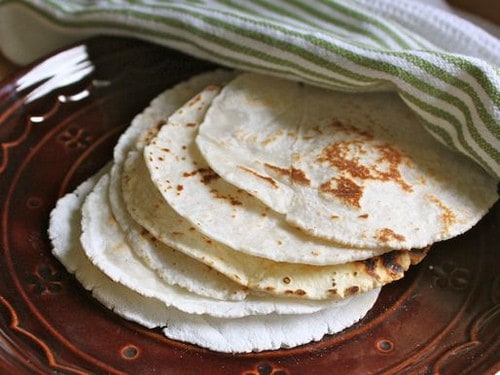 Gluten-free flour tortillas on plate.