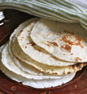 Gluten-free flour tortillas on plate.