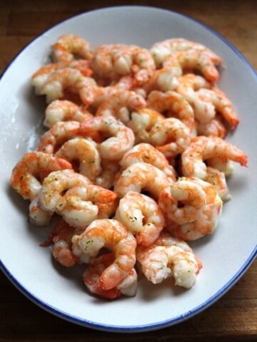 Cooked garlic shrimp on platter.