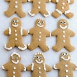 Gluten-free gingerbread cookies on parchment paper.