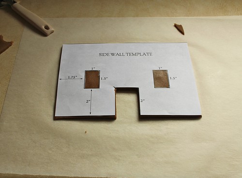 Side wall template on gluten-free gingerbread house dough.