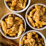 Four bowls of gluten-free apple crisp.