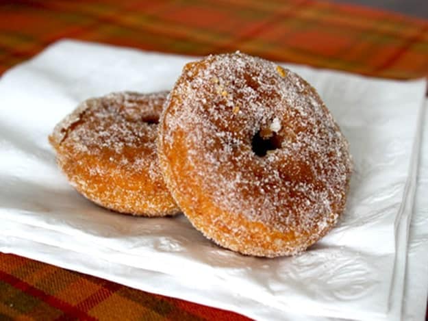 Gluten-Free Baked Pumpkin Doughnuts on a white napkin.