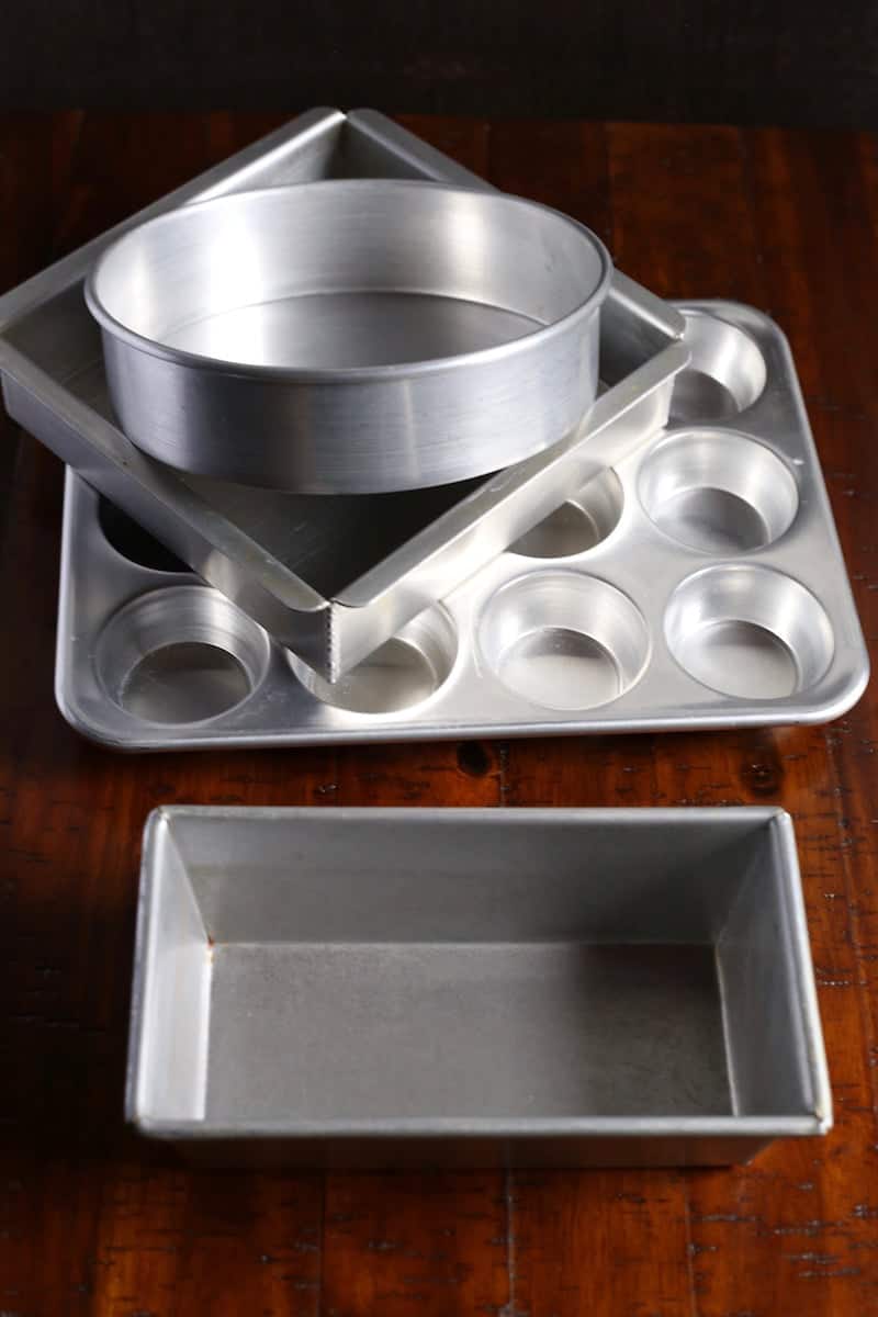 Different cake pans. Loaf pan. Muffin pan. Square cake pan. Round cake pan