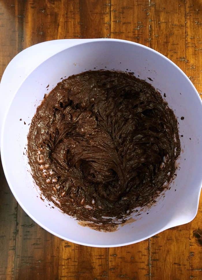 Gluten-free brownie batter in purple bowl.