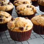 Gluten-free chocolate chip muffins cooling on a rack.