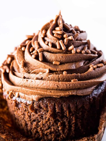 Gluten-free chocolate cupcake with chocolate frosting. Unwrapped from cupcake liner.