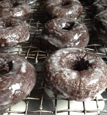 Baked gluten free chocolate doughnut on cooling rack