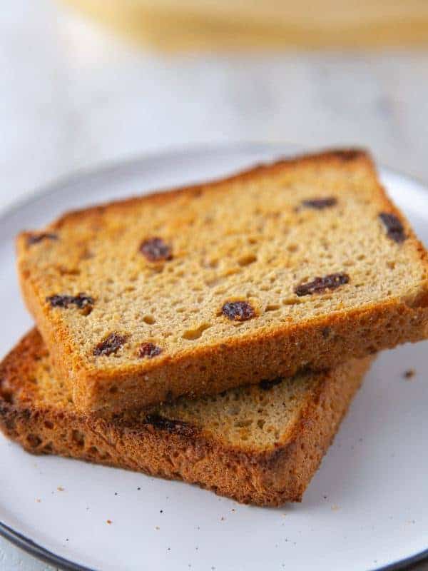 Stack of toasted cinnamon raisin bread slices.