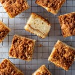 Squares of baked gluten-free coffee cake on a wire rack