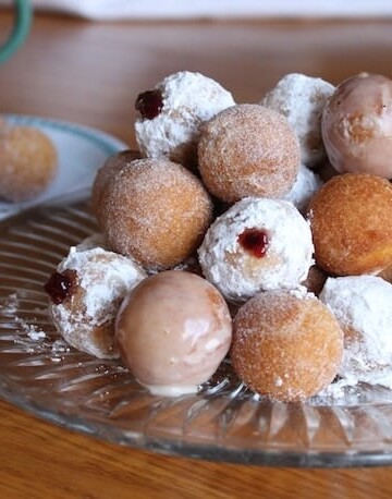 Gluten-free doughnut holes on plate.