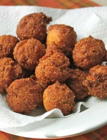 Gluten-Free Hush Puppies on a paper towel-lined bowl.