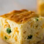 Slice of Jalapeno cornbread on brown parchment paper.