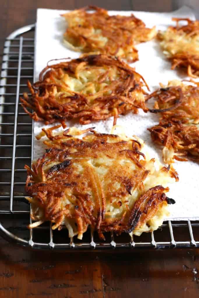 Gluten-Free latkes on a wire rack.