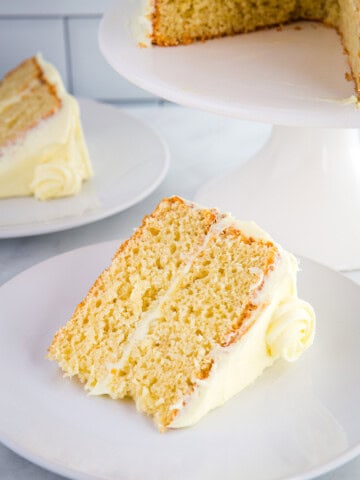 Slice of gluten-free lemon cake on a white plate.