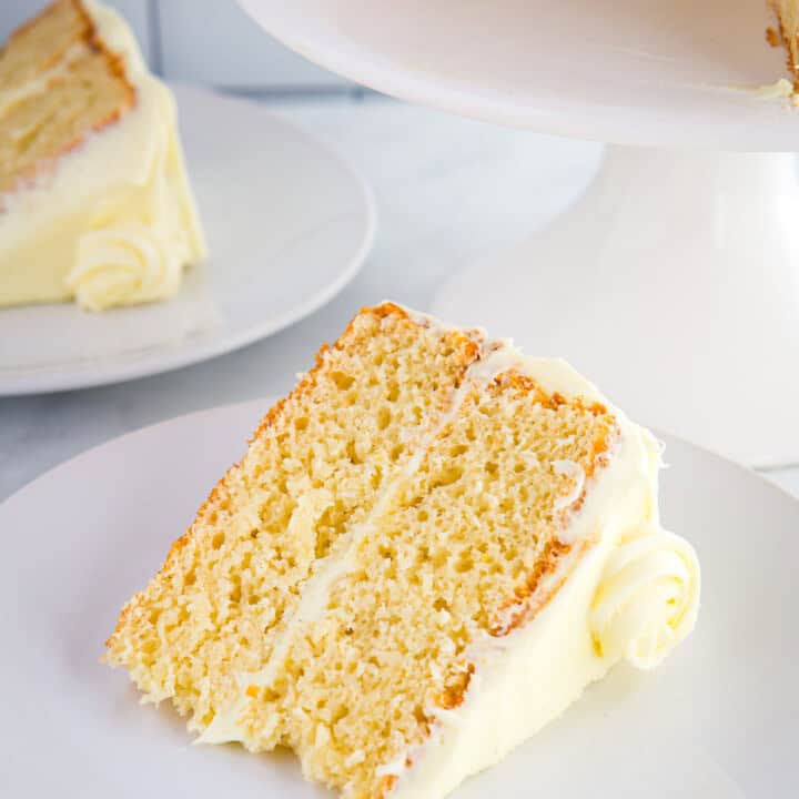 Slice of gluten-free lemon cake on a white plate.