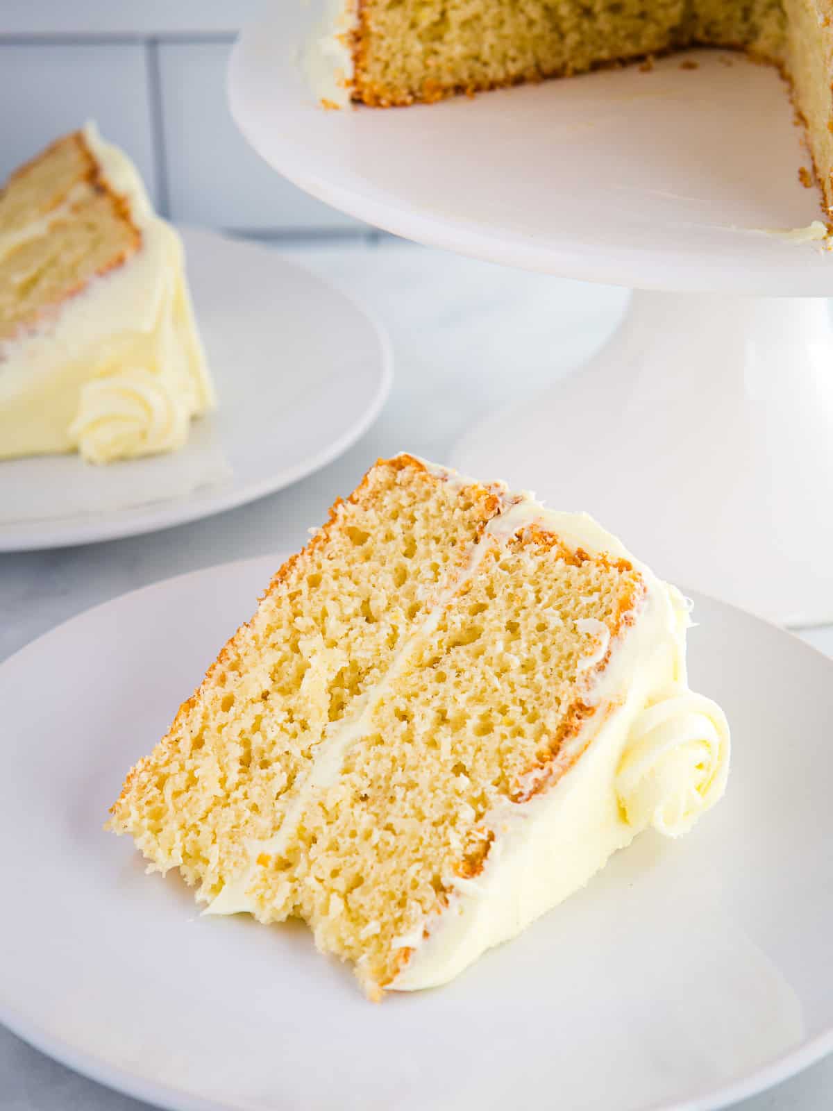 Slice of gluten-free lemon cake on a white plate.