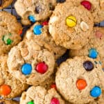 Gluten-free monster cookies on a wire rack.