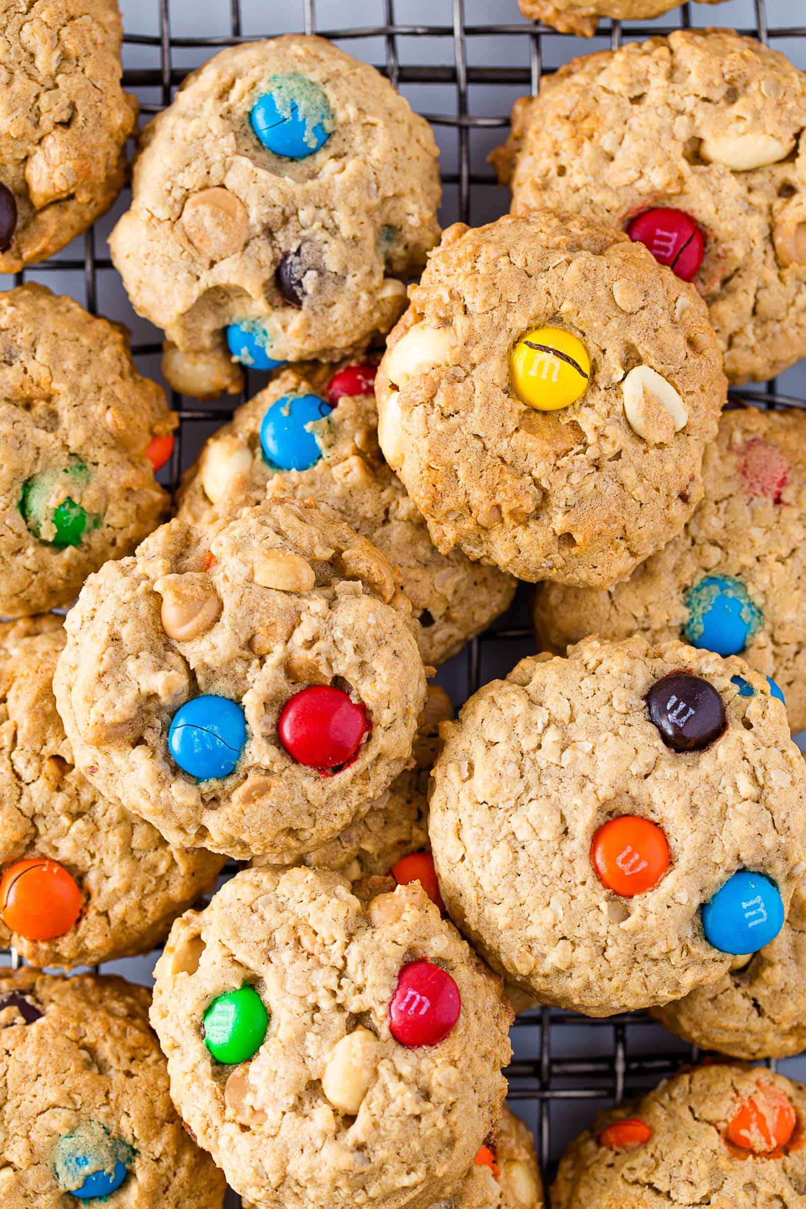 Gluten-free monster cookies on a wire rack.