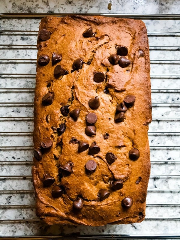 Baked gluten-free peanut butter banana bread on cooling rack