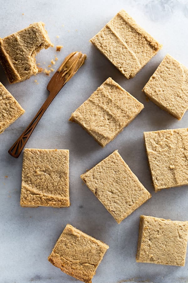 Gluten-free peanut butter blondies on a marble pan. 