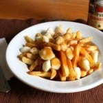 Gluten-Free Poutine in a white bowl.