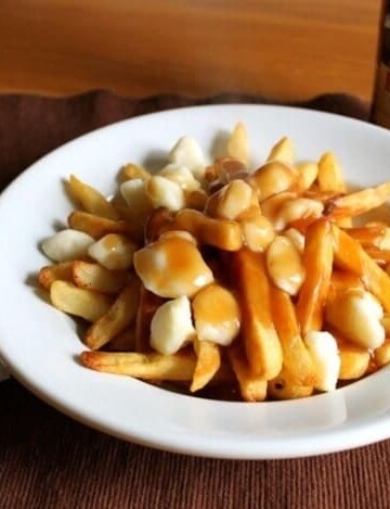 Gluten-Free Poutine in a white bowl.