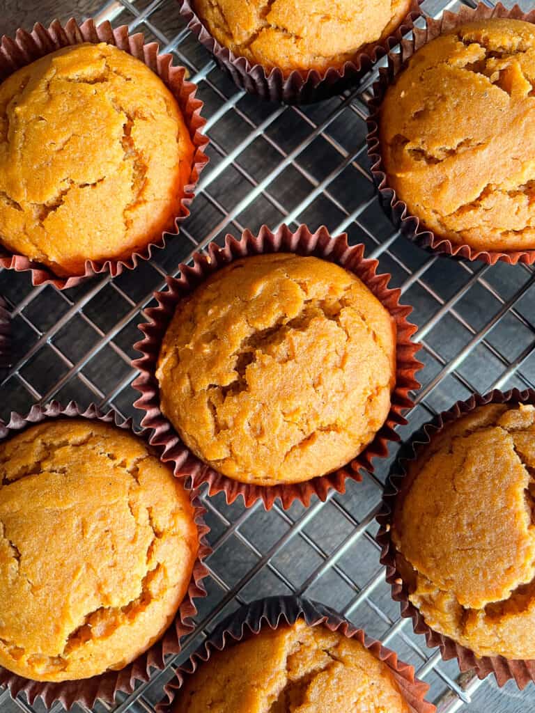 Gluten-free pumpkin muffins on a cooling rack.