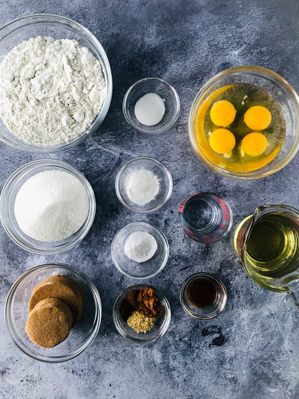 Ingredients in bowls for gluten-free spice cake. 