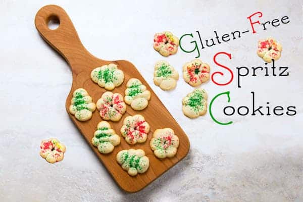 Gluten-free spritz cookies on cutting board.