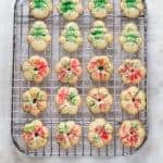 Gluten-free spritz cookies on wire rack.