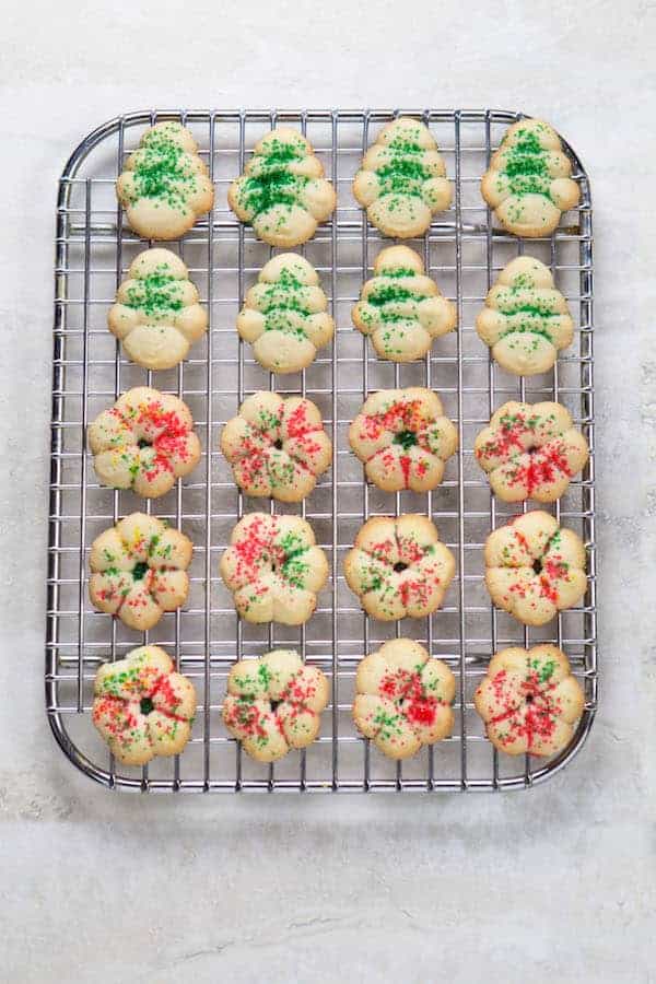 Gluten-free spritz cookies on wire rack.