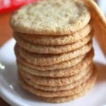 Stack of gluten-free sugar cookies on a white plate.