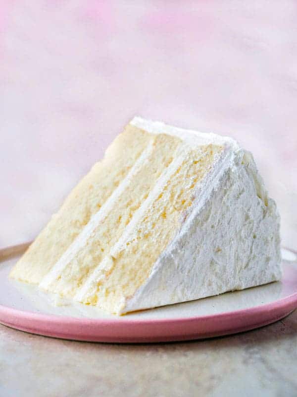 Gluten-free white cake slice on plate.