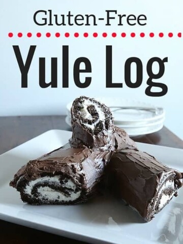 Gluten-free yule log on a white platter.