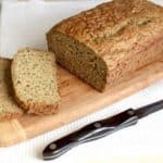 Gluten-Free Zucchini Bread on wood cutting board.