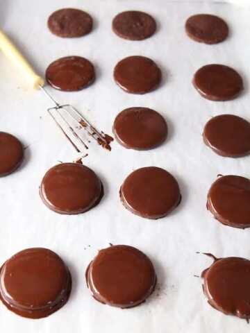 Paleo thin mint cookies dipped in chocolate.