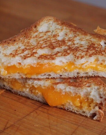 Gluten-free grilled cheese on a cutting board.