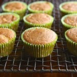 Paleo apple muffins cooling on a wire rack.